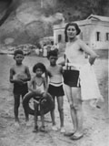 My mother Girgee with us as children at the beach at Lai Chi Kok. (1937)