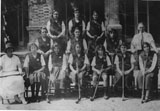 Photo of the 1922 Whangpoo Road Jewish School Hockey team. In the photo are my mother Girgee, Headmaster J. P. Jones, Esther Bloomfield, Emma Nissim, Nora Toeg and Mrs Westfield, the hockey coach.