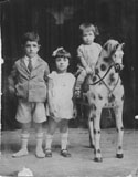 Cousins Abe, Esther and Solly (on the rocking horse). (1934)