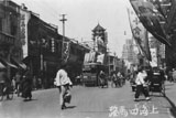 Peking Road with trolley car and rickshaw.