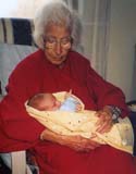 My mother, Girgee, at 92 years of age holding her great-grandson, Ty. (2002)