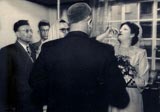 Weddings were sometimes held in private homes. My father and I are witnesses at the private wedding of family friends Jack Cohen and Helen Levy. (1947)